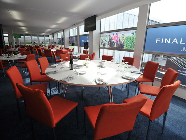 Burnt orange Rio chairs in one of Cheltenham Festival's hospitality dining areas